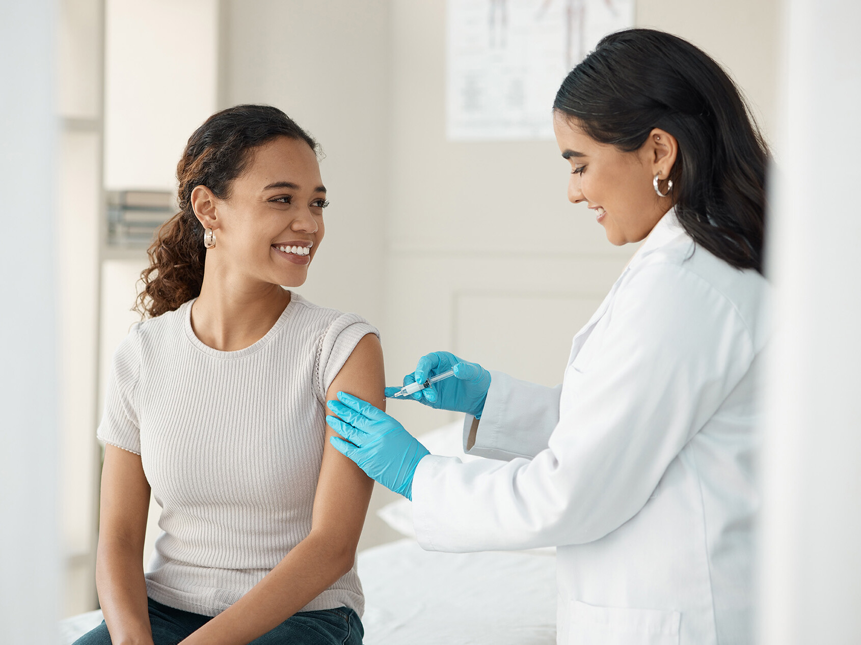 Chromatography resins: Innovation for the healthcare industry A woman being vaccinated by a doctor