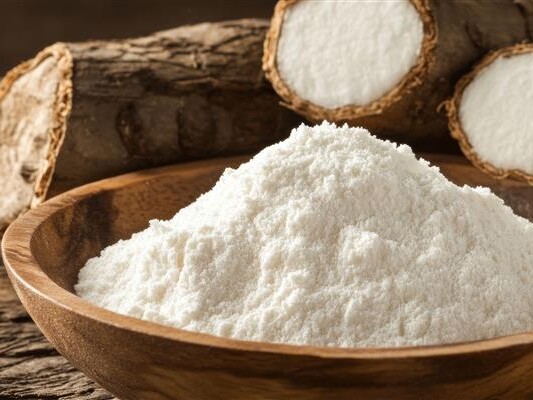 CareStarch: the versatile benefits and uses of tapioca starch Tapioca roots behind a bowl of starch