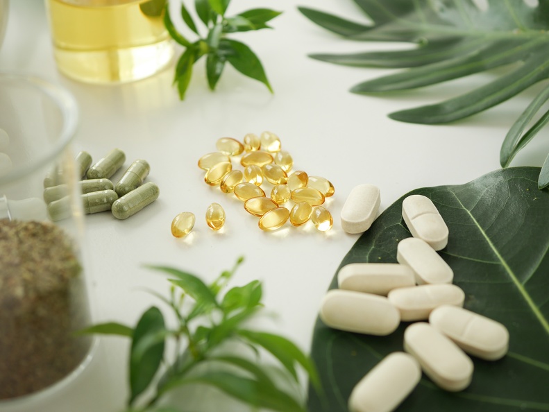 New penetration and bioavailability booster for pharmaceuticals Pills and capsules on a table and on leaves