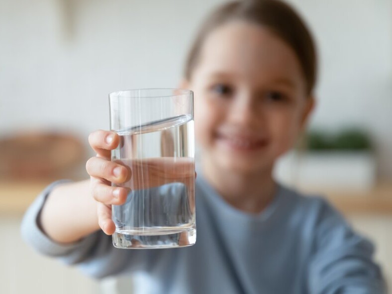 THERMAX N990CG from Cancarb receives FDA Food Contact Notification Approval Girl holding a glass of water